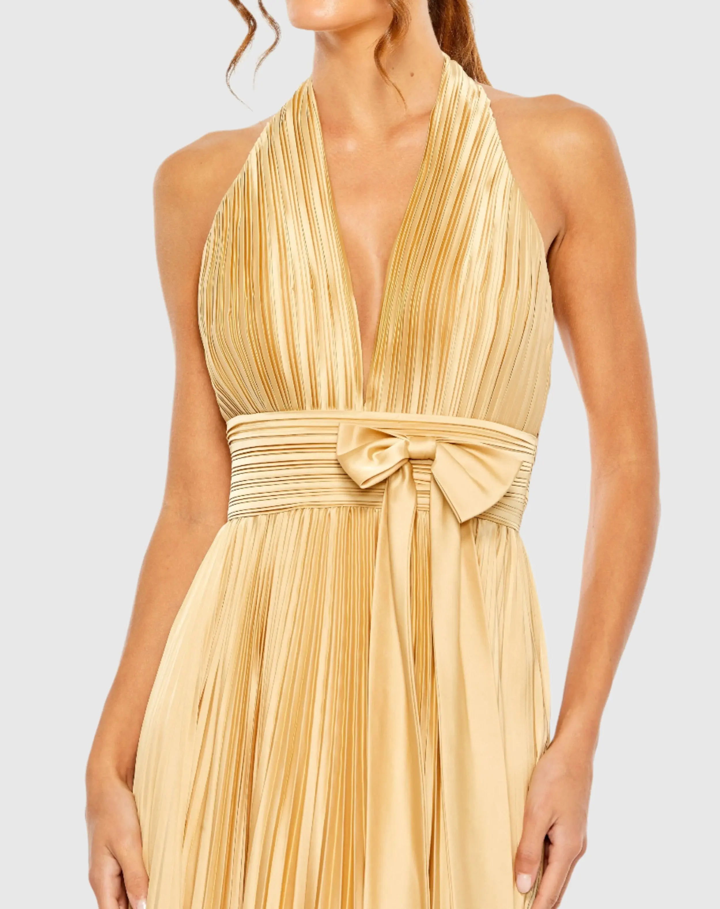 Gold Pleated Halter Neck Gown with Center Bow - Image 3